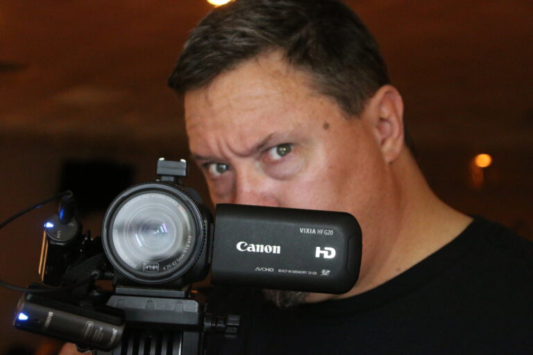 Bill Blackburn holding a camera
